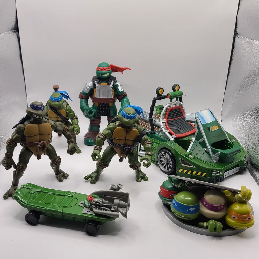 TMNT  Figure And  Accessories Lot Ninja Turtles lot damage  wheels